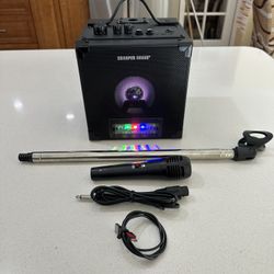 Sharper Image Model: SBT1050 Rechargeable Karaoke Singing System.