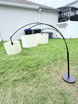 Selling arc floor lamp with 3 shades.