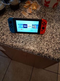 Nintendo switch with joycons and games  installed.