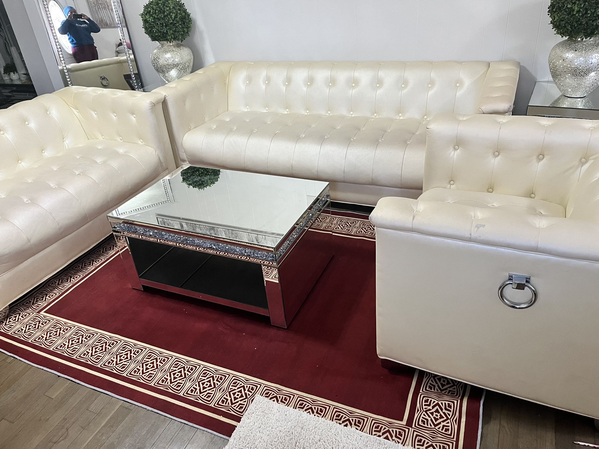 Cream Couches And Glass Table