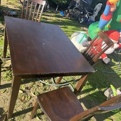 Table With Four Chairs The Table Is 4 X 3