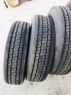 BRIDGESTONE DRIVES M713 295/75R22.5. COMMERCIAL TRUCK AND TRAILER TIRES