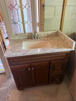 Bathroom vanity with countertops, backsplash and sink