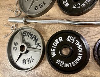Olympic Curl Bar & Cast Iron Weight Plates: 35s, 22s, 11s and 5s. Total: 164 lbs.