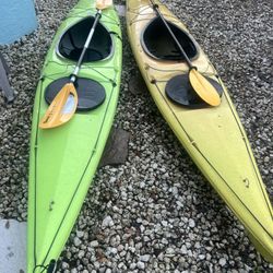 2 Kayaks With Paddles
