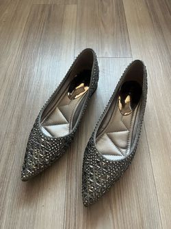 Sparkly pointed-toe flats in gunmetal silver