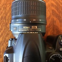 Nikon D3000 SLR With Nikon DX VR Lens