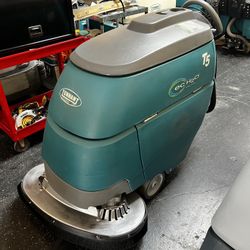Tennant T5 wall behind floor scrubber 24”