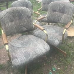 a set of 4 ugly dining chairs