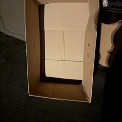 Large, long, and flat cardboard boxes (and smaller boxes not shown).