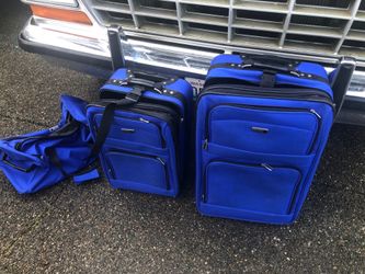 Set of Blue travel luggage’s and bag
