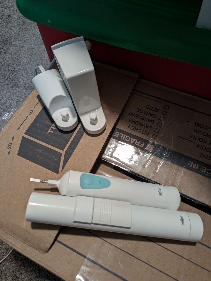 2 Braun Electric Toothbrushs
