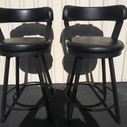 2 Black Swivel Bar Stools for $30. 25" seat height