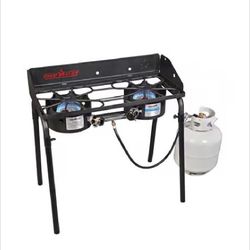 Coleman two burner stove on legs with carrying case