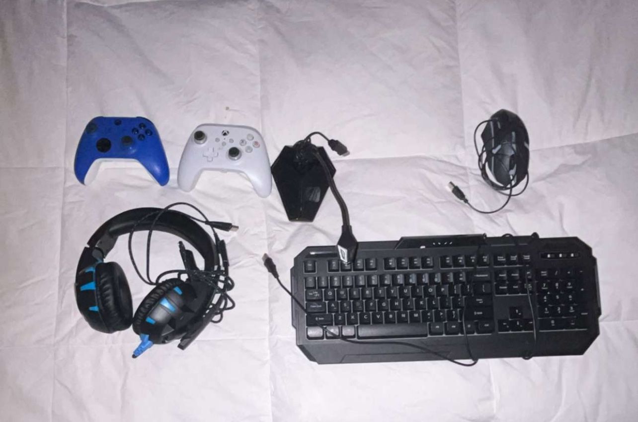 blue, white, and black xbox controllers, keyboard, mouse, mic, headset