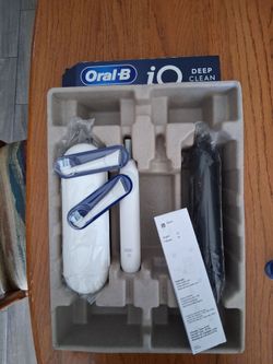 Brand New.  Oral-B IQ Toothbrush. Has 2 Travel cases, charger, 2 Brush Heads, Instruction manual and 1 Toothbrush.
