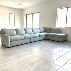 Grey sectional. Living Spaces custom Aspen L shaped sectional.