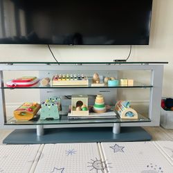 Modern glass TV stand with shelves