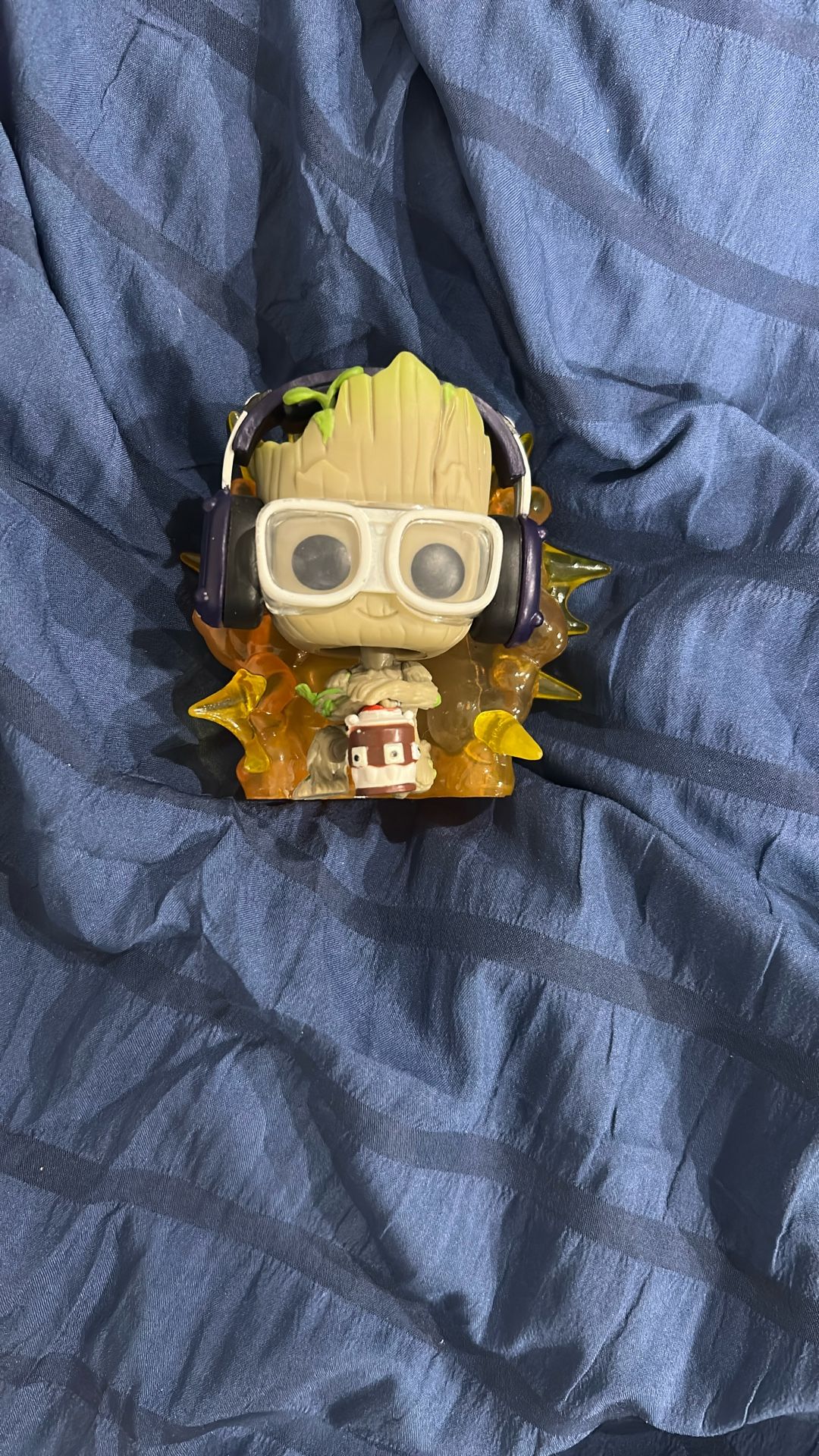 Groot with glasses and headphones and fire behind him Funko pop