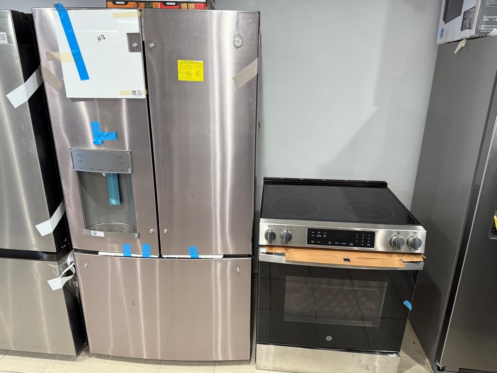 Kitchen GE Refrigerator French Door & Electric Slide Stove In Stainless Steel