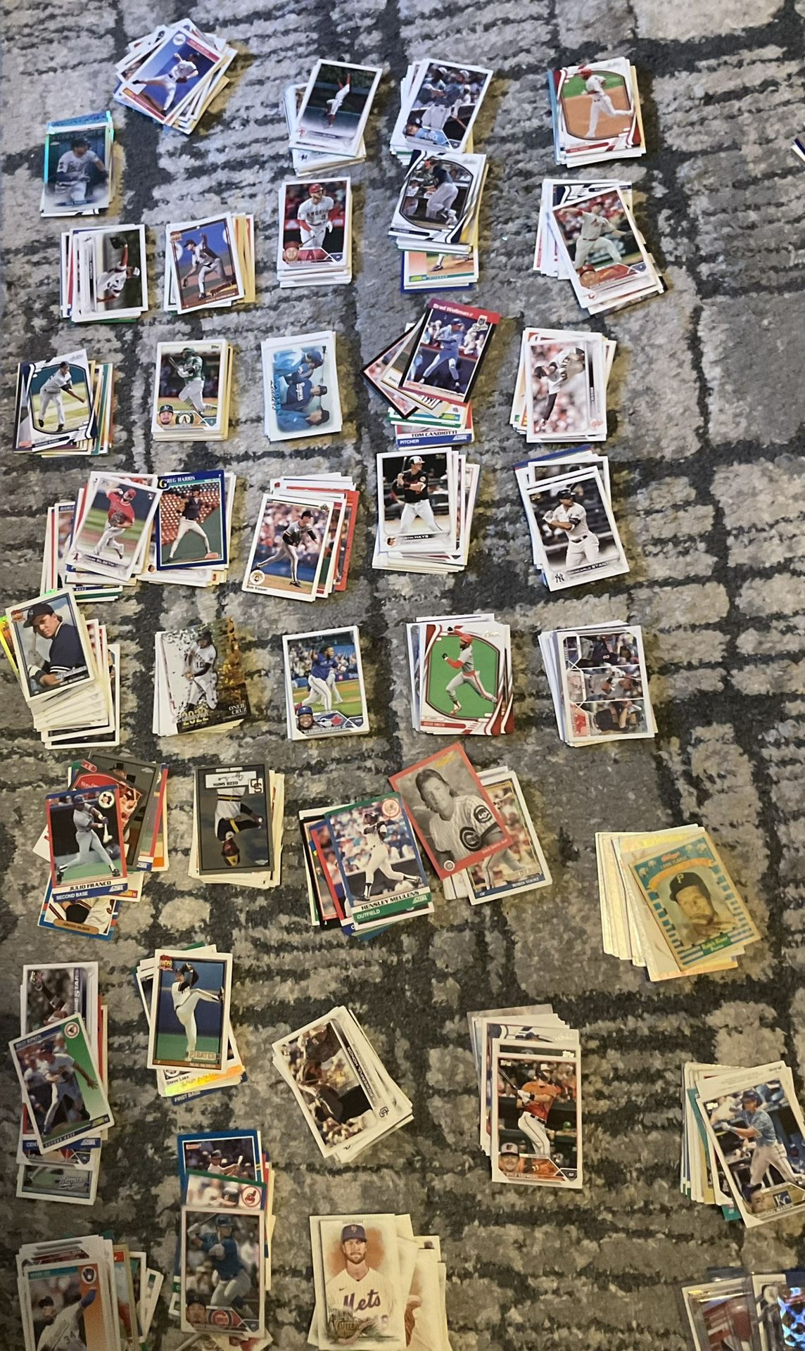 Collection of mixed baseball and basketball & football trading cards.