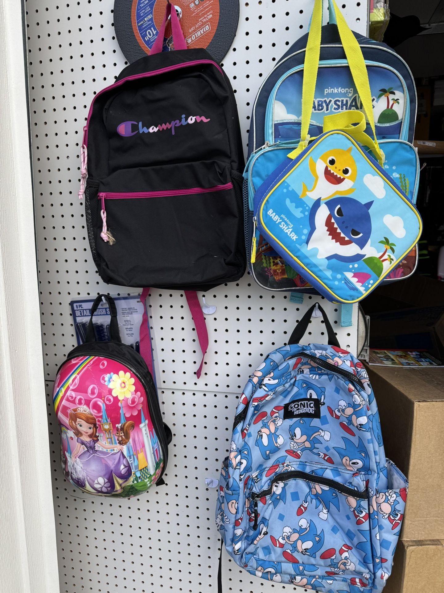 7 Back Packs And Few Lunch Boxes