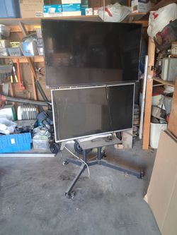 2 tvs on a stand