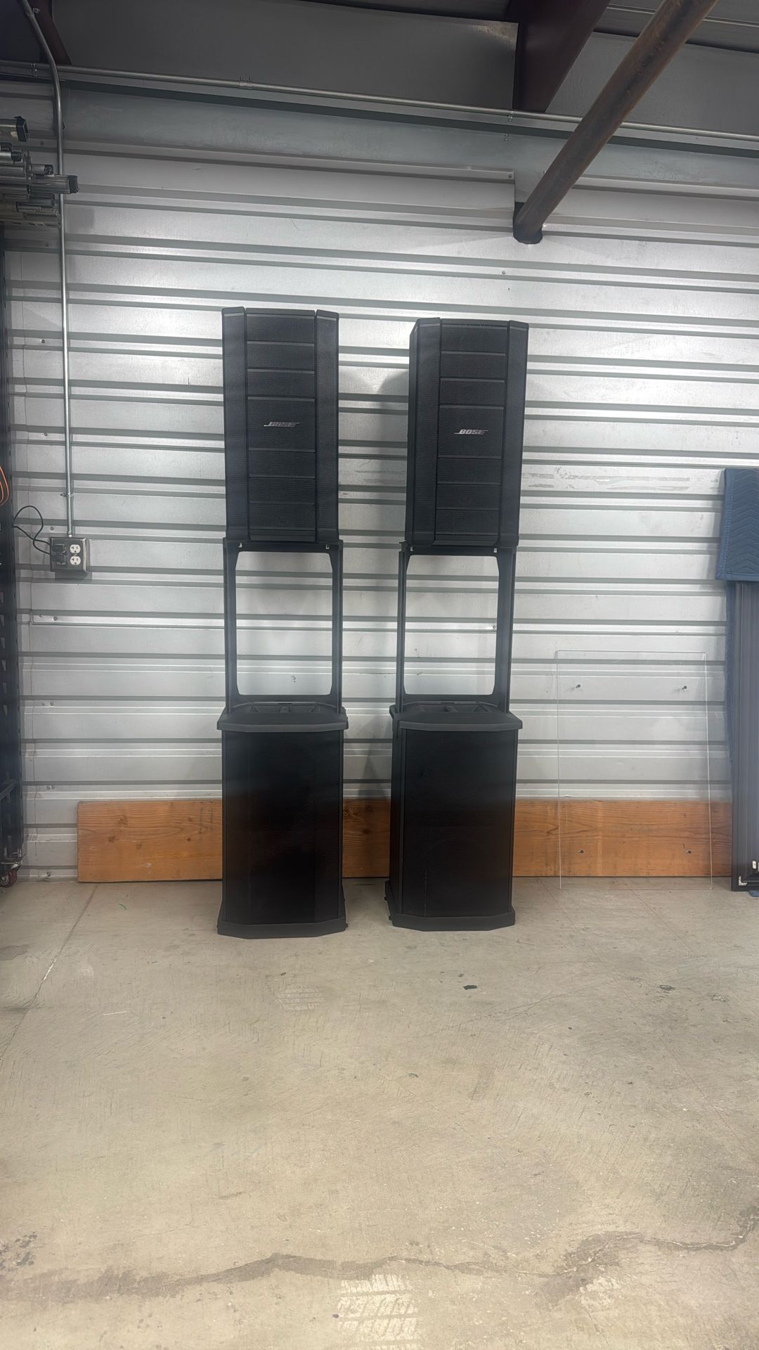 A Set Of Bose F1 Speakers