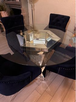 Circular dinning table with blue chairs