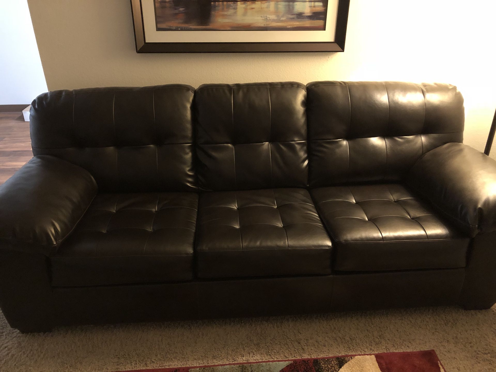 Black leather sofa/ bed