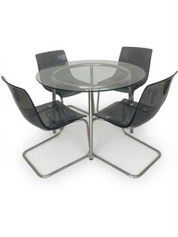 Round glass dining table and 4 chairs