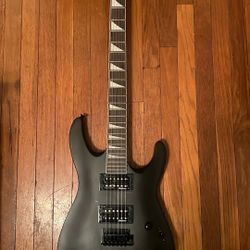 Black Jackson Guitar With Line 6 Amp