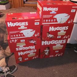 6 Boxes Of Huggies Diapers