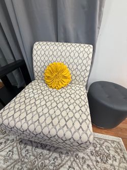 Two beige accent chairs