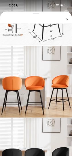 Set of 3 swivel orange bar stools.