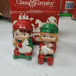  Avon
Claus & Company Santa's
Helpers porcelain salt and
pepper shakers.