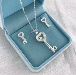 Sterling silver key and floating rhinestone necklace and earring set!