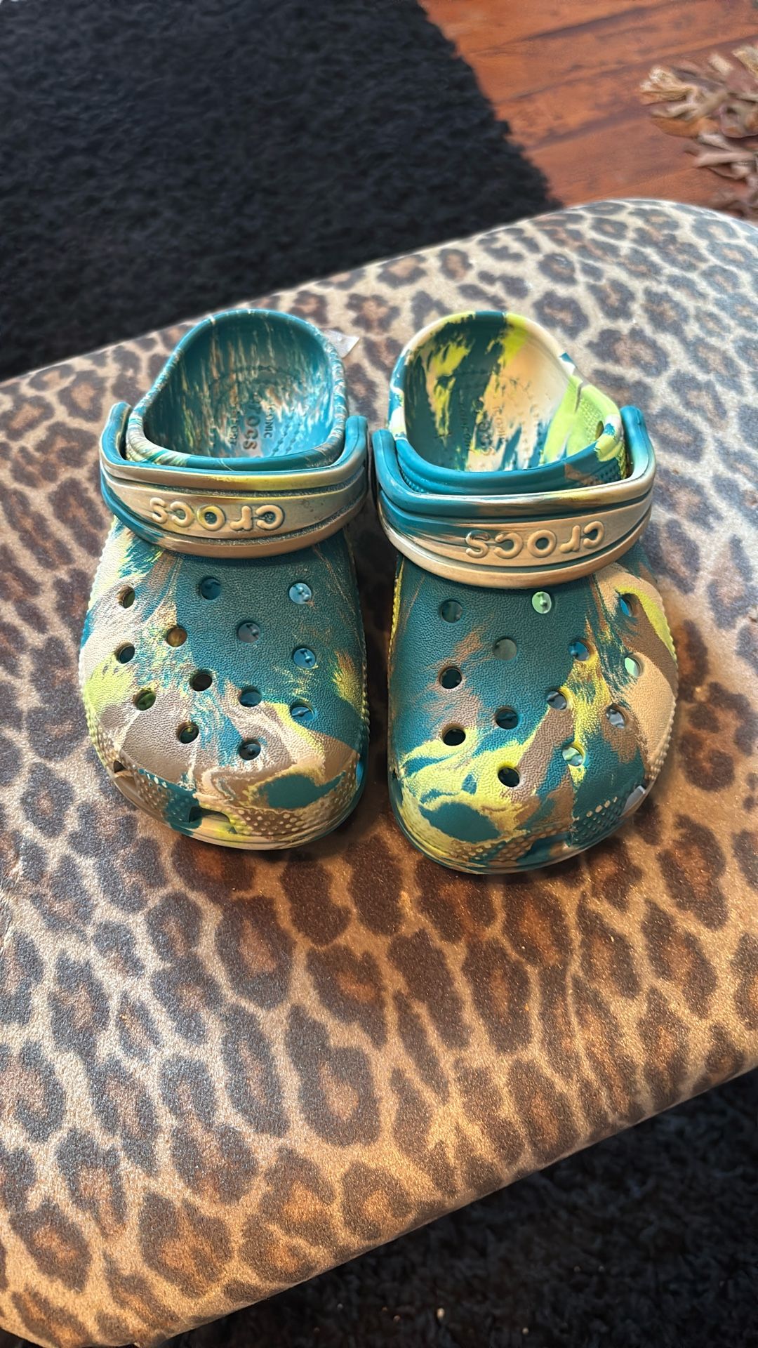 Crocs in a blue, yellow, and tan colorway.