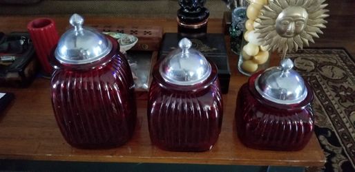 Red decorative canisters