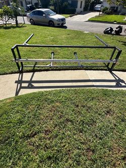 1. Carpet or fabric roll holder - Store and dispense large rolls of material.  2. Outdoor banner holder - Attach a large yard sale or advertising bann