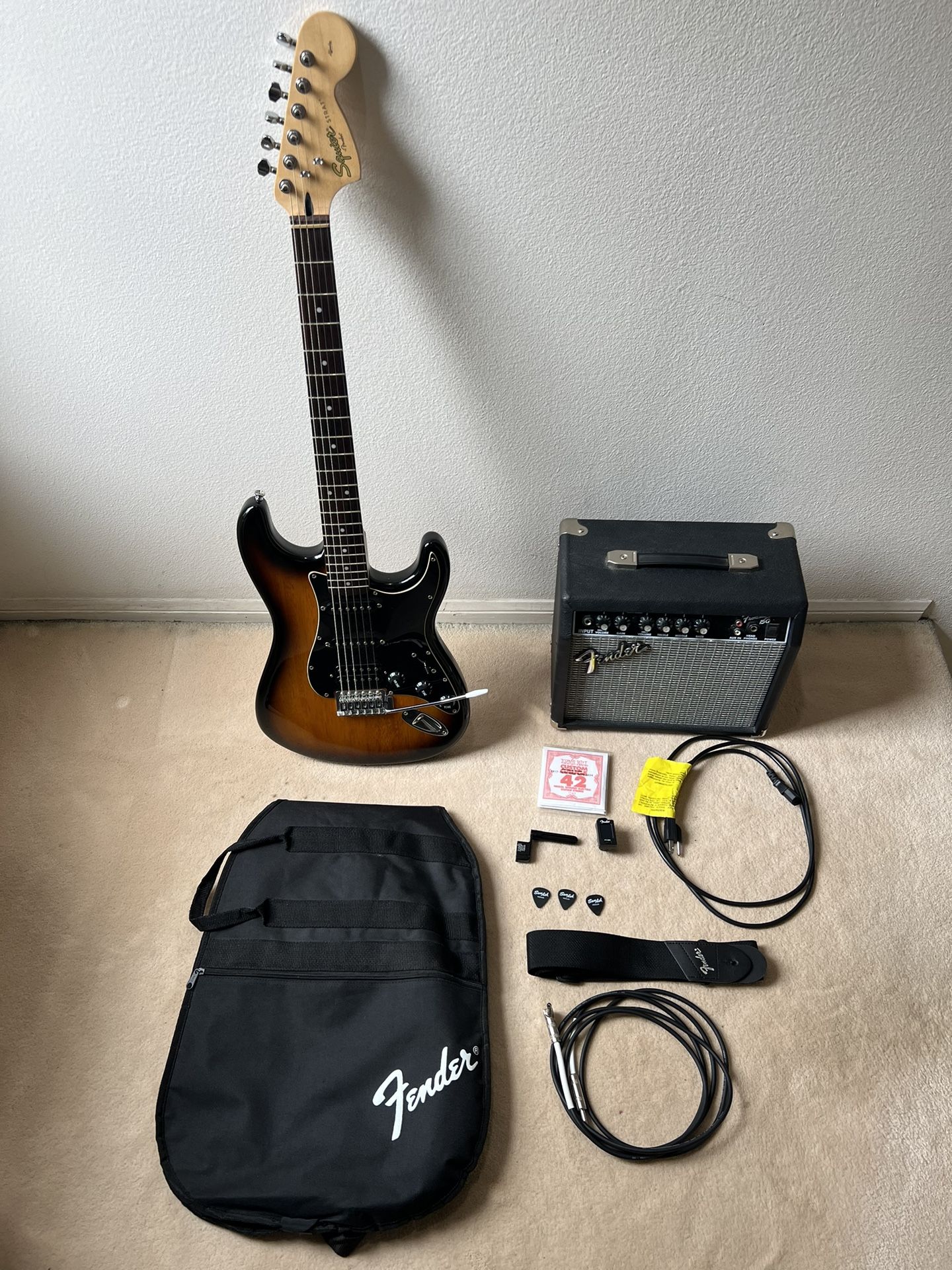 Squier Affinity Series Stratocaster HSS Electric Guitar with Amplifier and Accessories