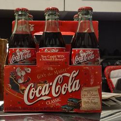2001 Santa on a sleigh 8oz coke collectable bottles