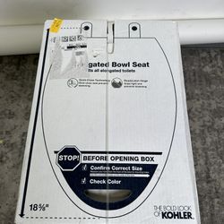 Kohler elongated toilet seat.