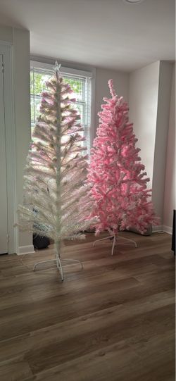 Two prelit Christmas trees, one cotton candy white and a pink one 6 ft