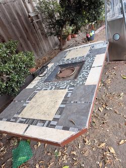 Outdoor Tile Table with Fire Pit- no propane tank included Decorative outdoor table with built-in fire pit. Ideal for garden or patio.