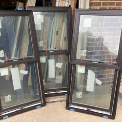 New Andersen windows , bronze exterior , single hung , 27 1/2 by 57 1/2