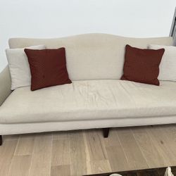 FREE Modern Beige Sofa with Red Accent Cushions – Sleek & Cozy