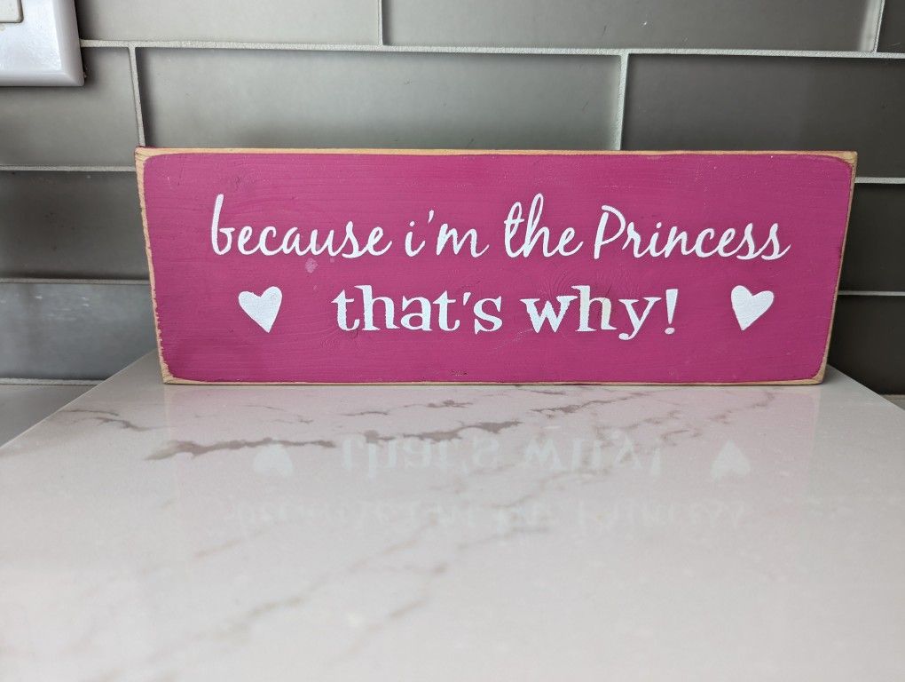"Because I'm the Princess thats why". Wooden sign