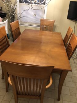 Solid maple table and six matching chairs.