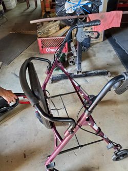 Walker ,padded Seat ,4 Wheels and Breaks , Used In Decent shape